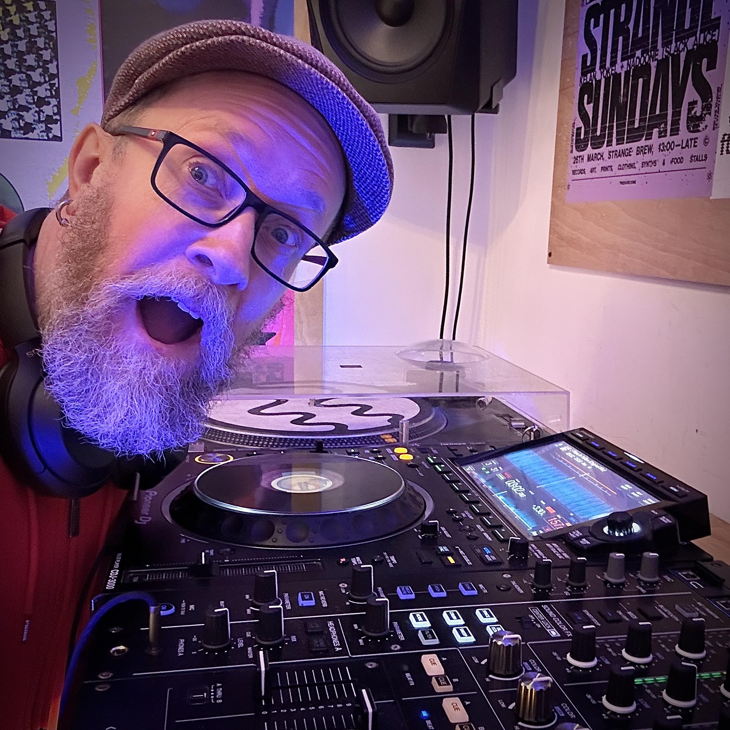 Me gurning like an idiot next to some DJ equipment